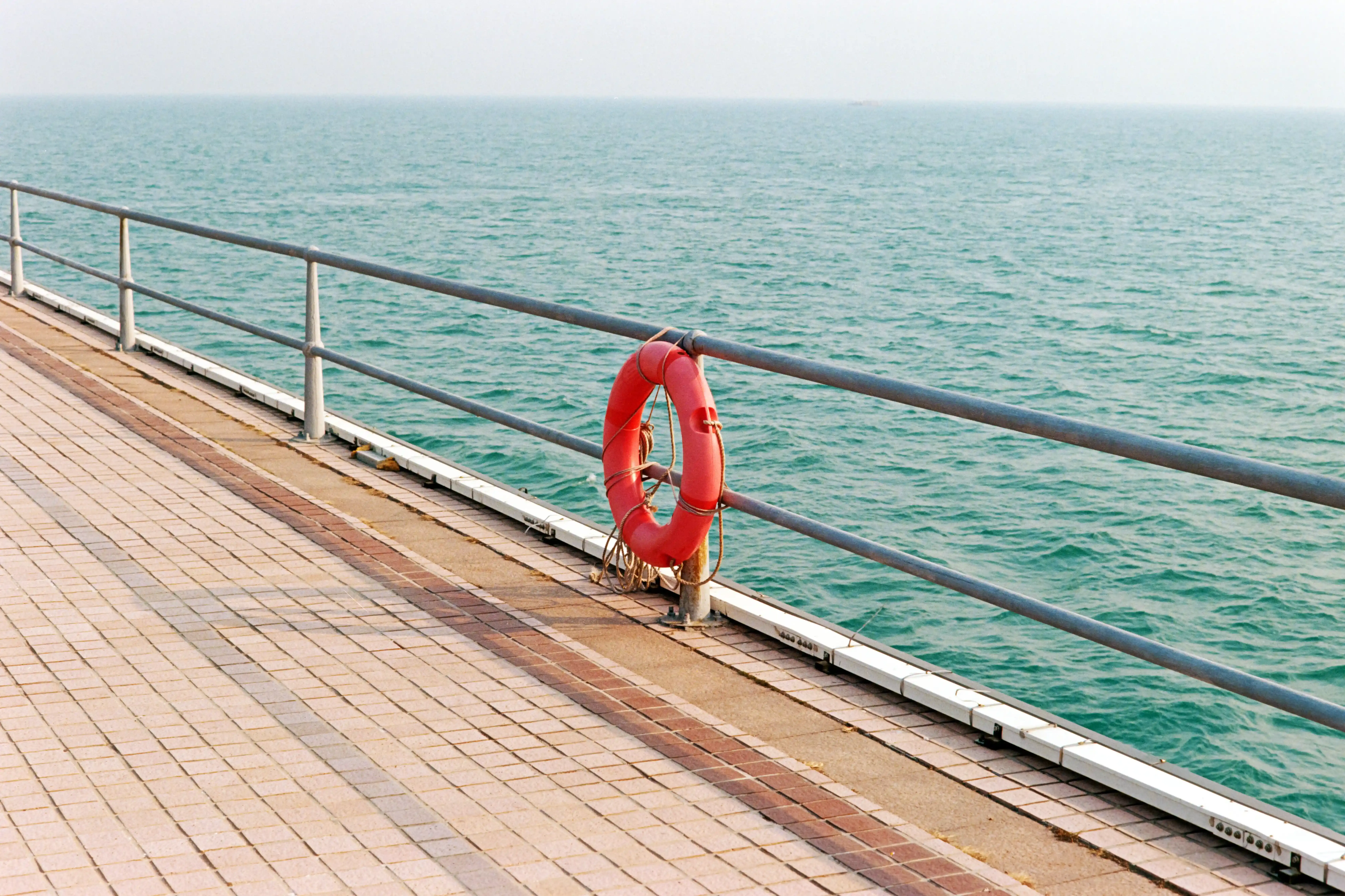 Lifebuoy on a Seaside Railing
